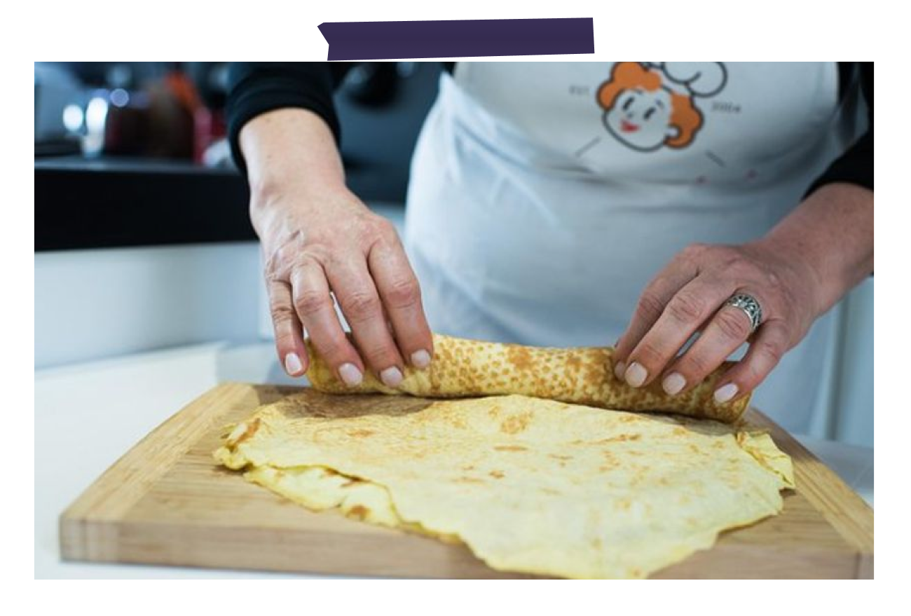 Corporate client enjoying a hands-on cooking class experience