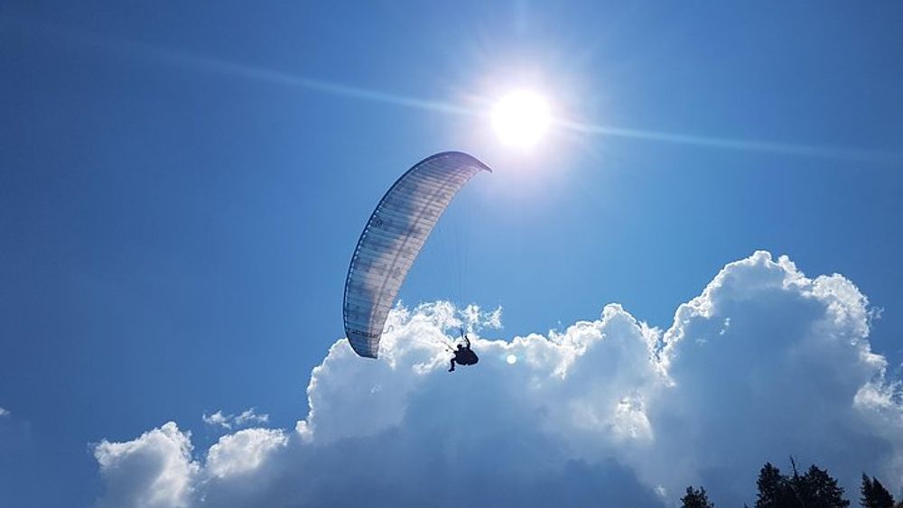 Tandem Paragliding Flight Above the Stubai Valley