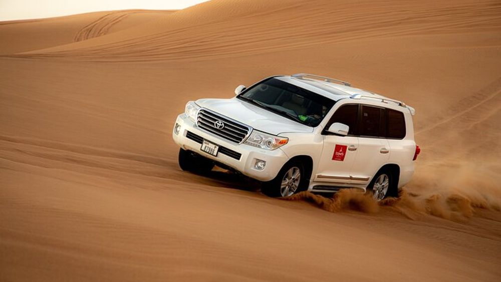 Dubai Sunset Red Dune Desert Safari, Sandboarding and Camel Ride