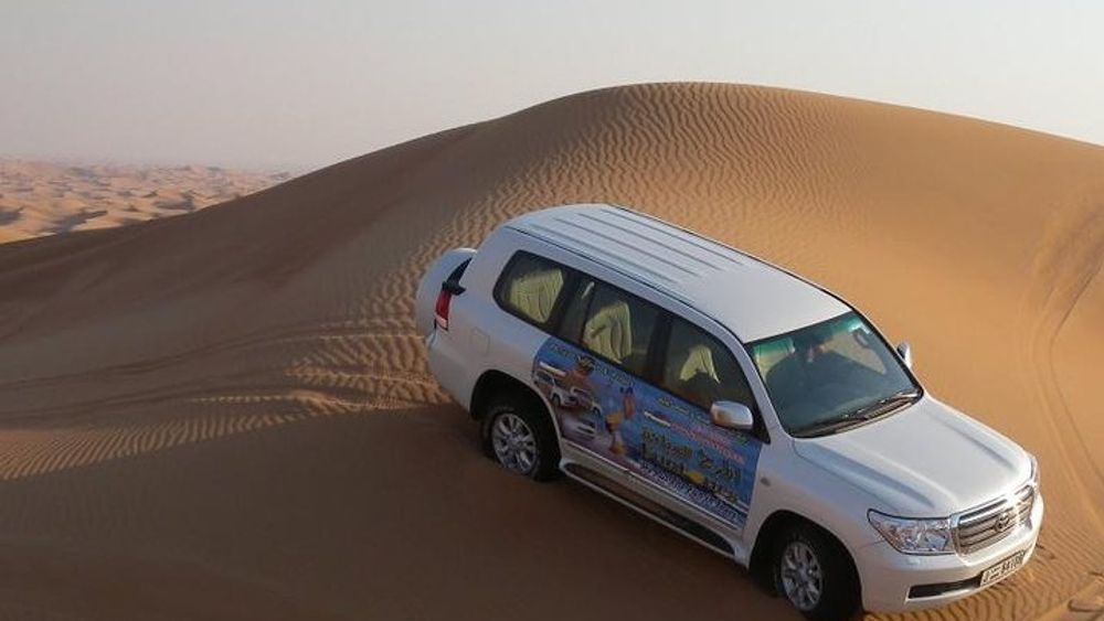 Morning Adventure from Dubai: Desert Dune Bashing, Sand Boarding, Camel Ride